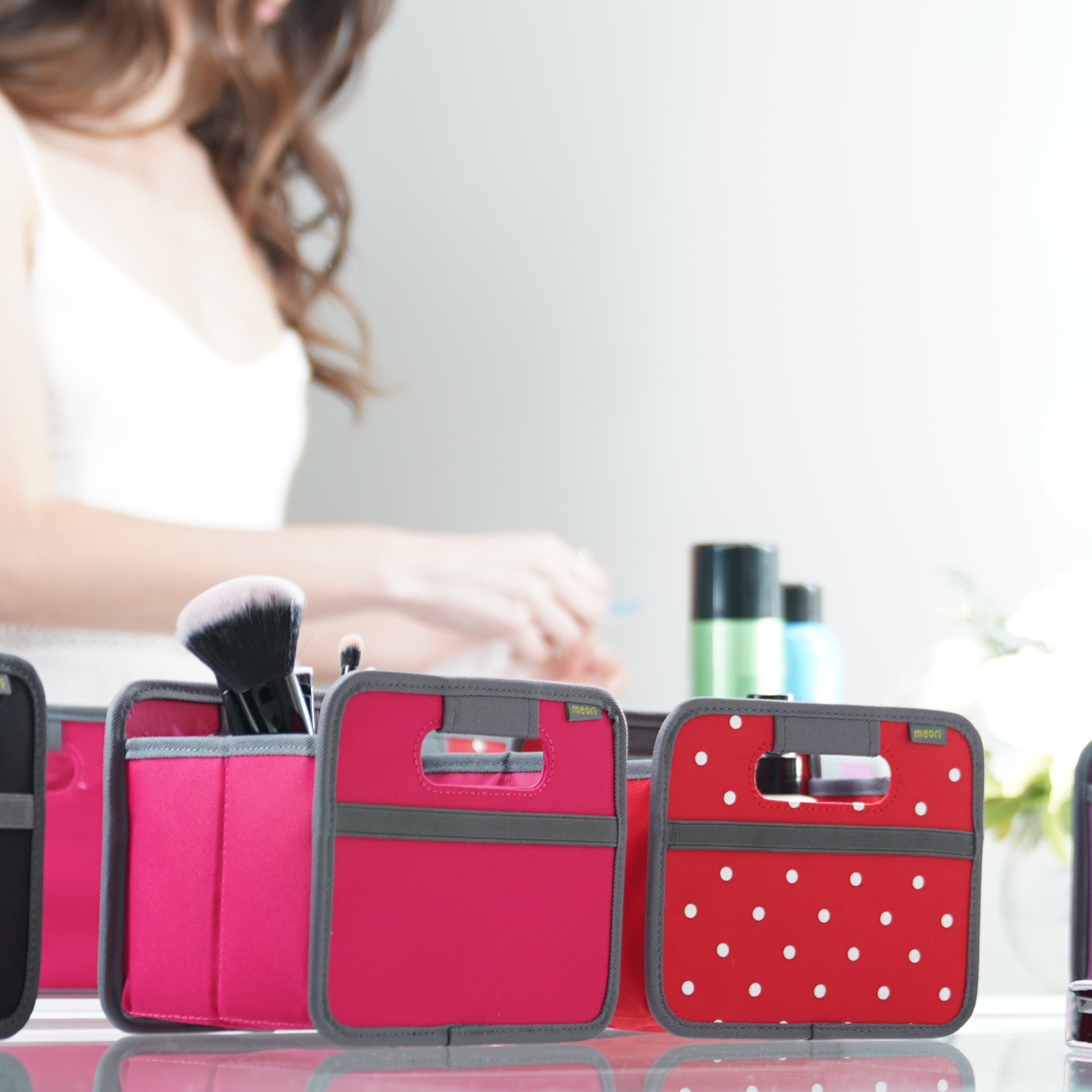 mini storage bins with cosmetics on counter