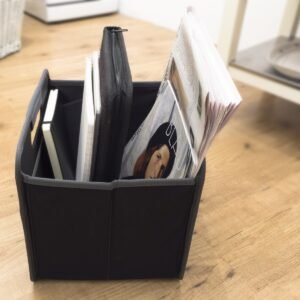 Magazine Insert shown in small black storage cube with content