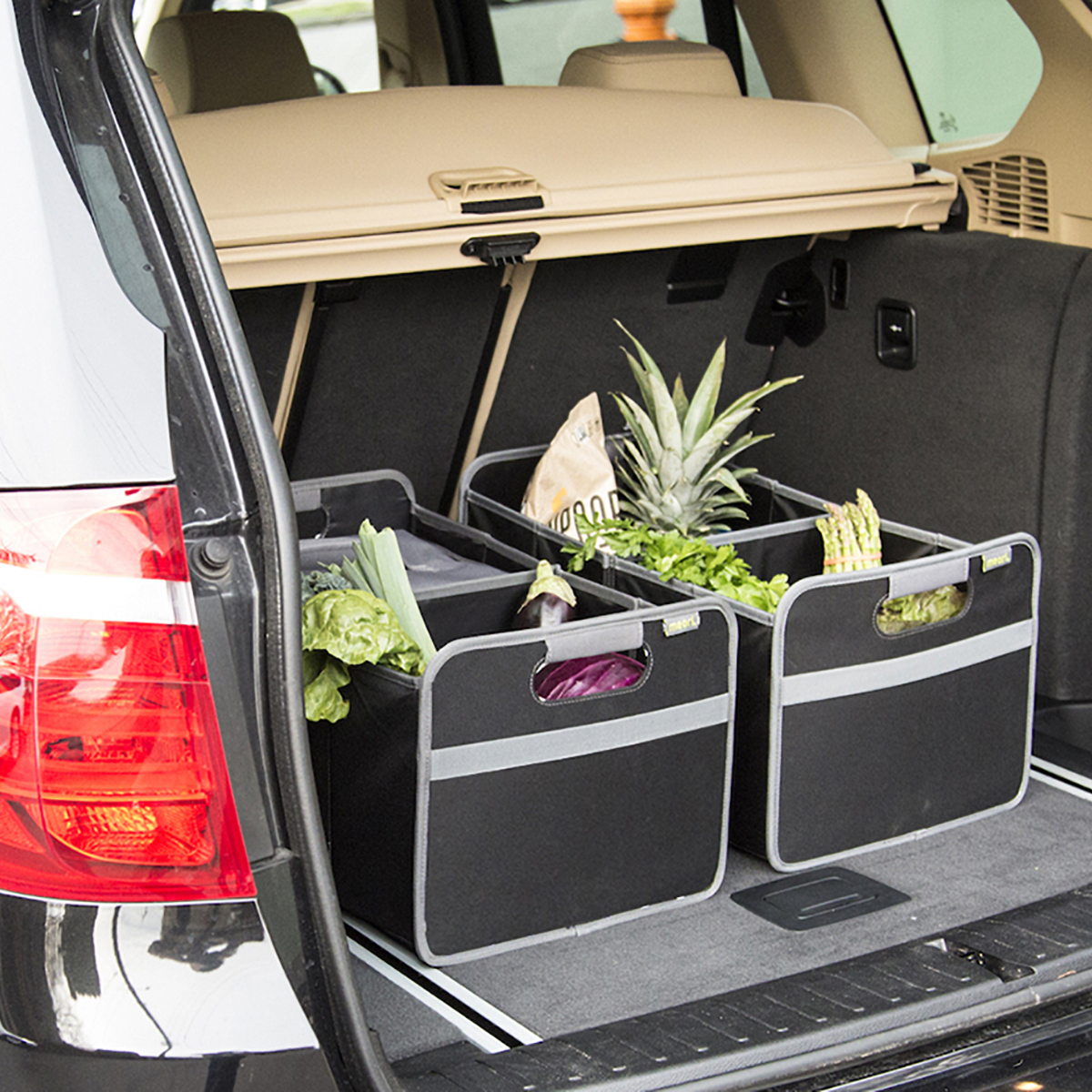 A100001-08-meori-Large-Foldable-Box-Lava-Black-LST Two Black Trunk Organizer For Groceries shown in the back of a trunk