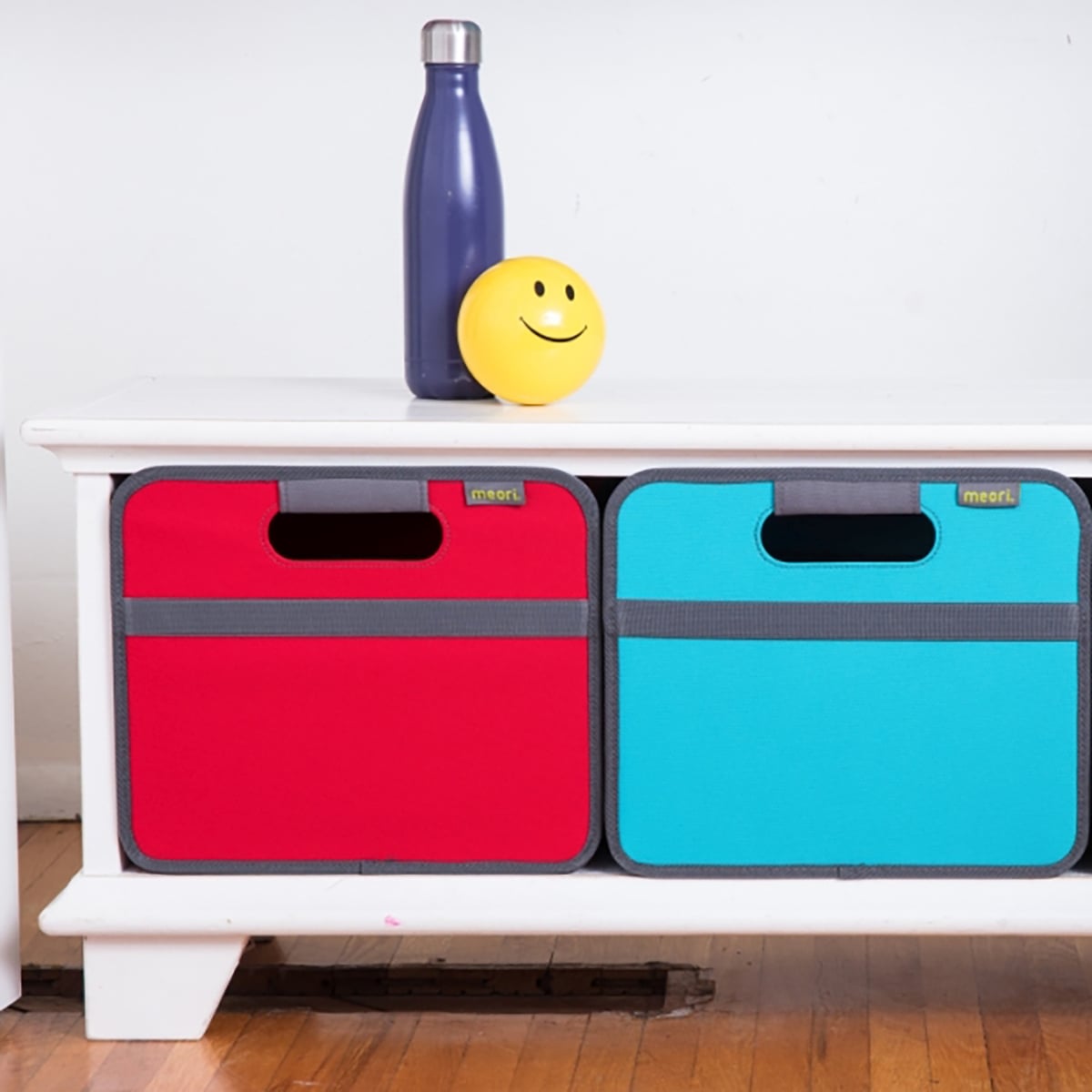Azure Blue and Red Collapsible Storage Bin in entry way