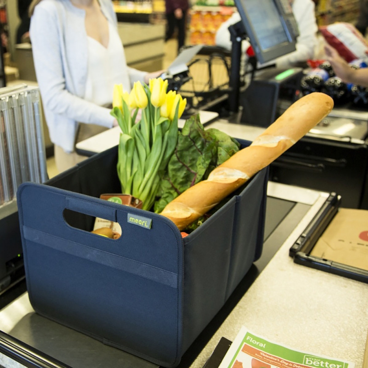 A100109-09-meori-Medium-Foldable-Box-Marine-Blue-LST Marine Blue Rectangular Storage Basket with groceries on checkout counter