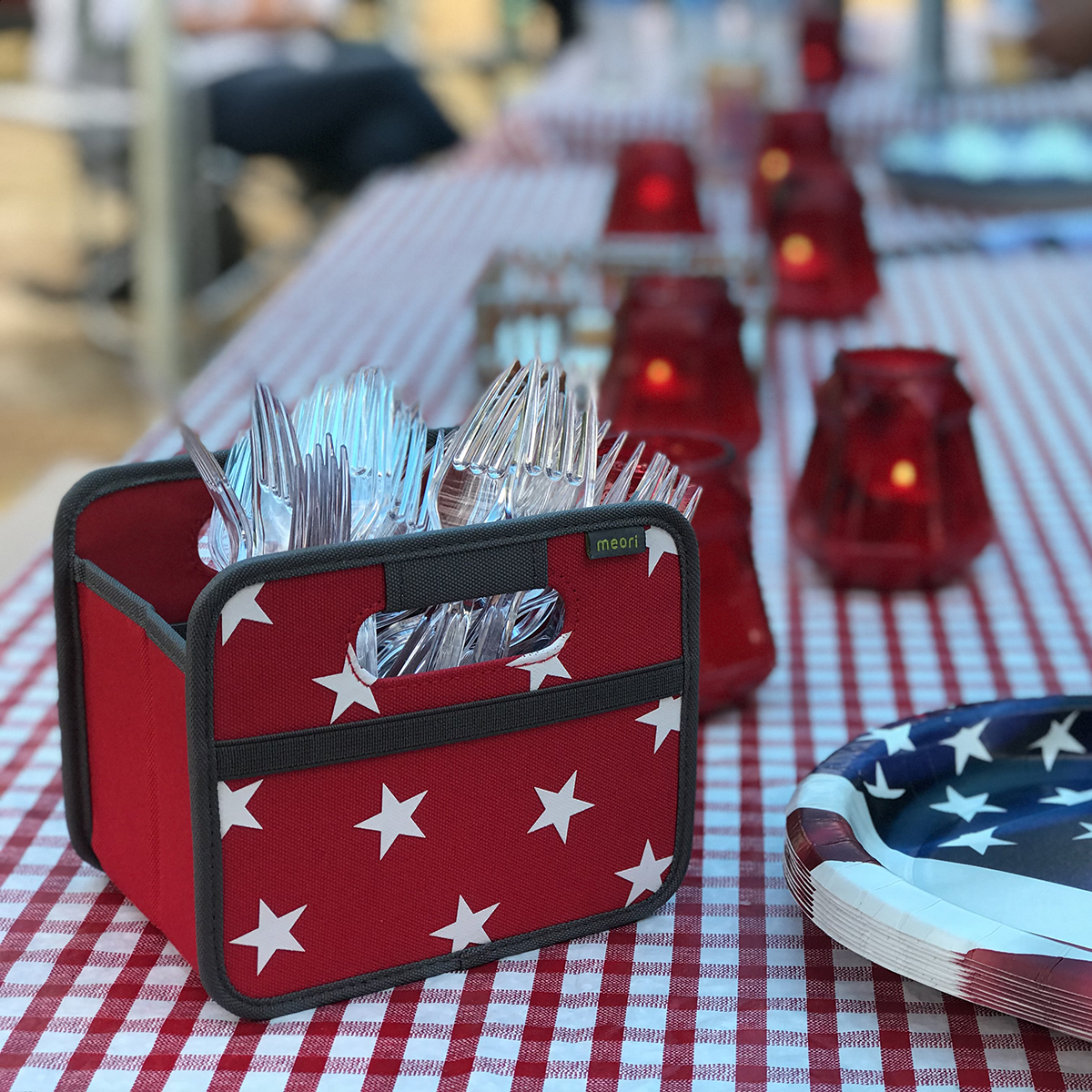 A100306-10-meori-Mini-Foldable-Box-Hibiscus-Red-Stars-LST Red Collapsible Fabric Storage Cube with White Stars filled with plastic forks on table