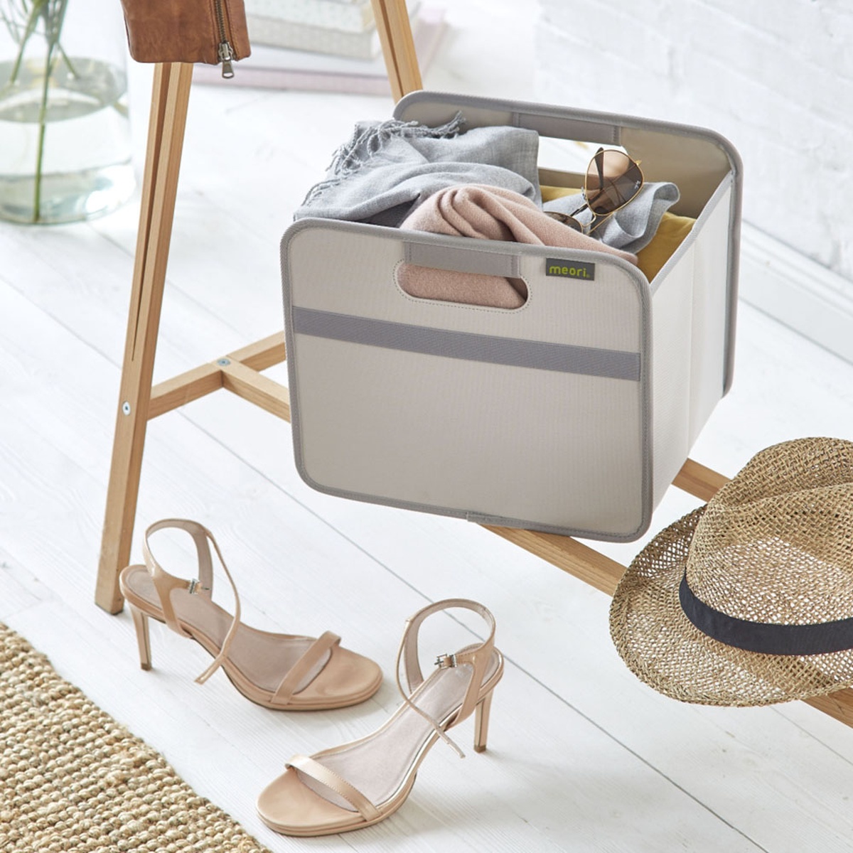 Sand-colored Collapsible Storage Bin holding scarfts and schals in entry way