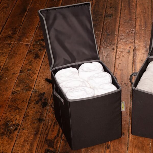 Black Small Storage Bin With Lid filled with six large rolled-up white towles