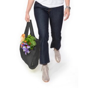 Black Reusable Grocery Tote with groceries and flowers being carried