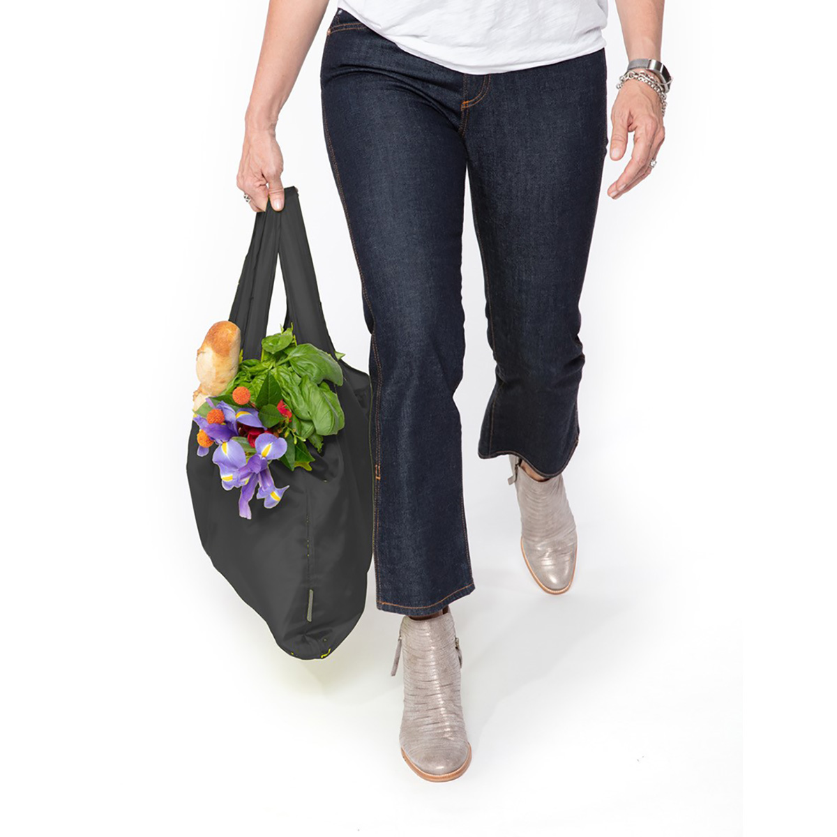 A100696-5-meori-Reusable-Pocket-Shopper-Black-LST Black Reusable Grocery Tote with groceries and flowers being carried