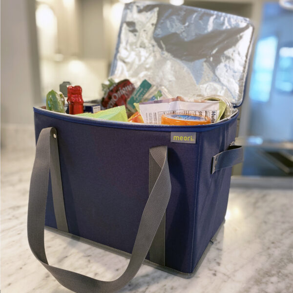 Marine Blue Insulated Grocery Bag With Zipper filled with groceries on kitchen counter
