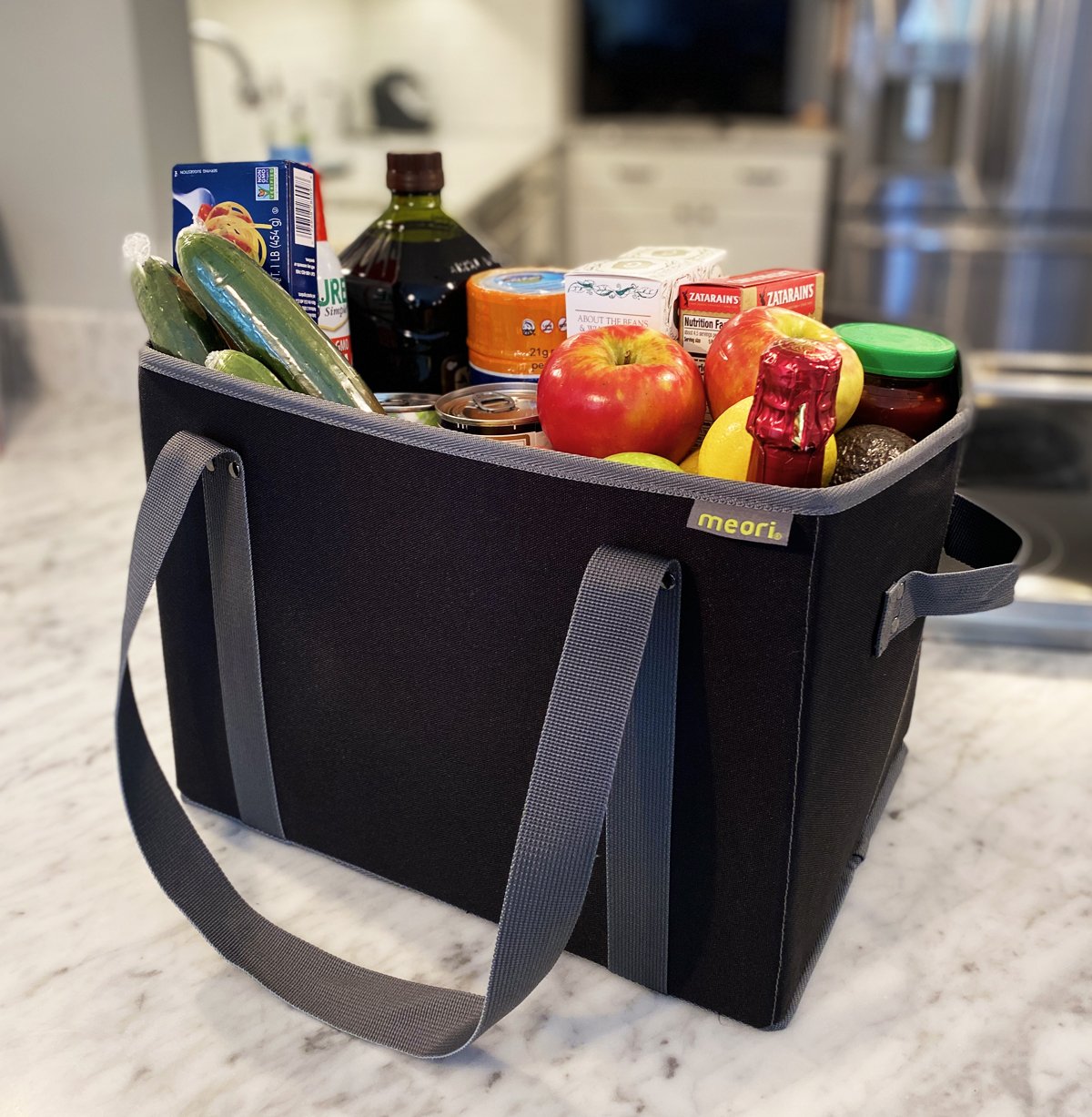 A100830-5-meori-Reusable-Grocery-Basket-Lava-Black-LST Black Collapsible Shopping Basket filled with groceries on kitchen counter