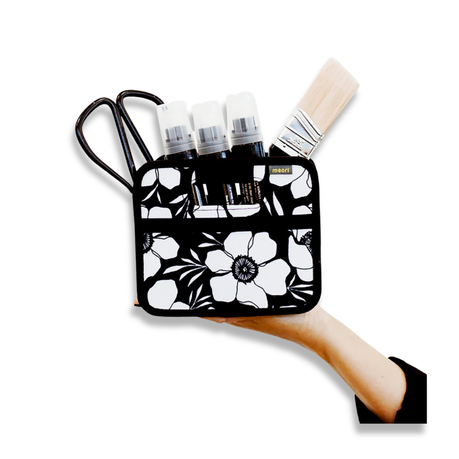 Black Small Storage Cube with White Floral Print with art supplies on palm