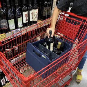 Woman putting wine bottle into Marine Blue 12 Bottle Wine Carry Bag sitting in a shopping cart