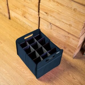 Empty Marine Blue 12 Bottle Wine Carry Bag sitting on the floor in front of wine crates