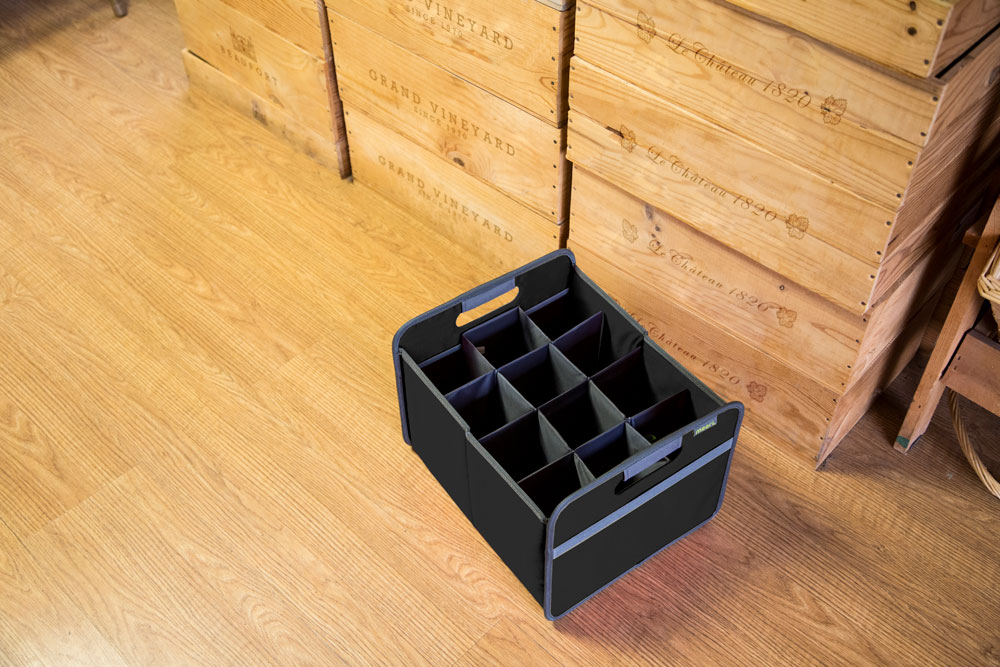 Empty Black 12 Bottle Wine Carry Bag sitting on the floor in front of wine crates