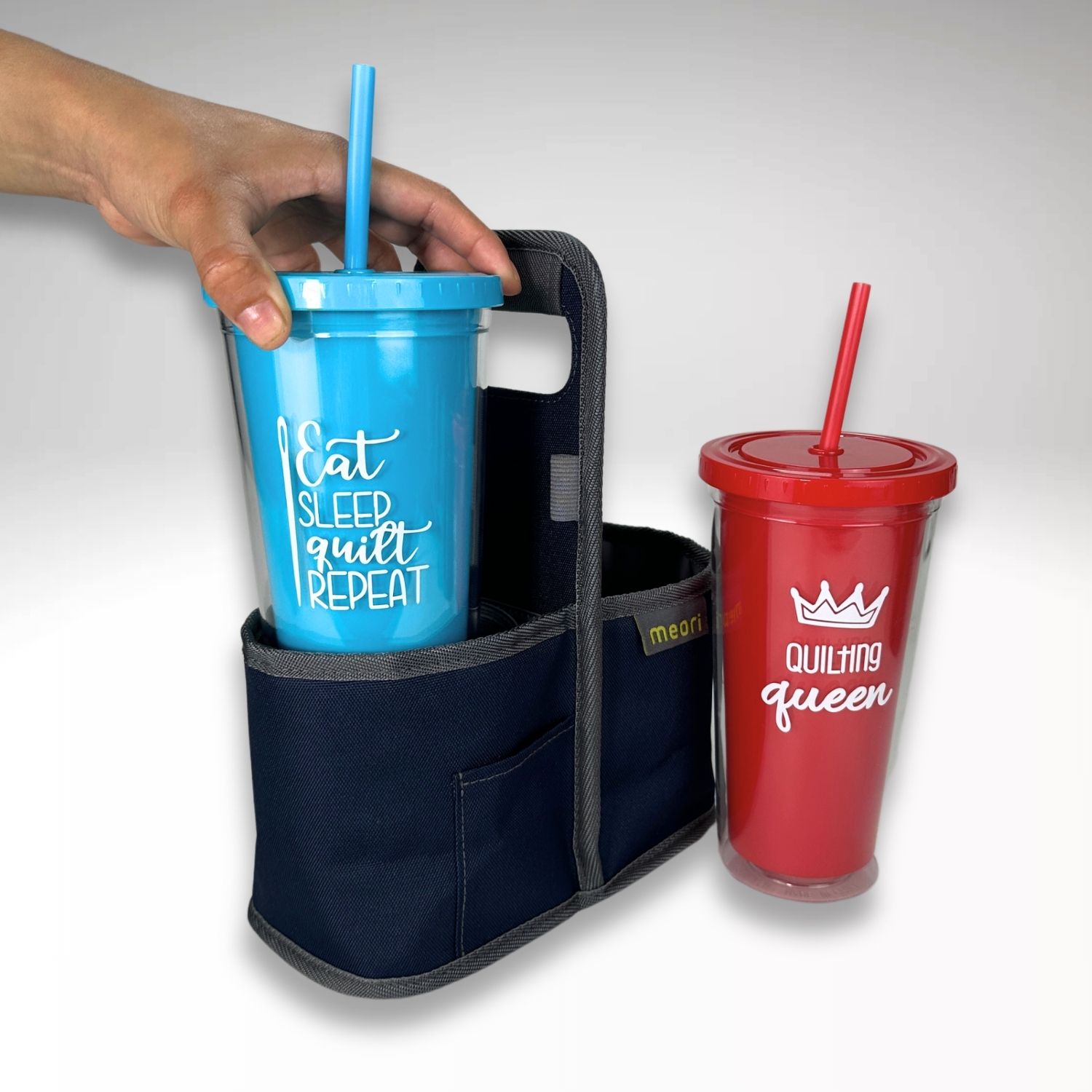 insulated tumbler with straw in red and blue with a 2-cup reusable drink carrier